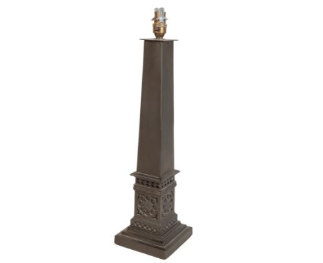 A PATINATED METAL TABLE LAMP of obelisk form, on a fretwork base, 50cm high, and another table lamp of urn form (2)