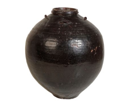 A CHINESE BLACK GLAZED VASE with applied decoration to the shoulders, 38cm high