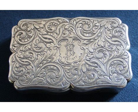 Victorian shaped silver table snuff box with elaborate engraved decoration on all sides, the central cartouche with initials 