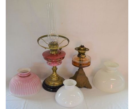 Two late 19th/early 20th century paraffin lamps with 3 shades plus a hanging paraffin lamp