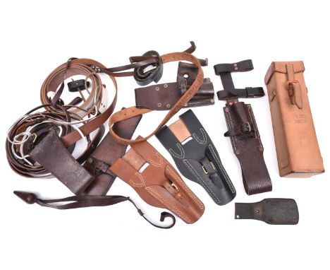 3 leather frogs, with belt loops, one dated 1960; 3 other frogs, new; a leather instrument case, stamped with broad arrow ove