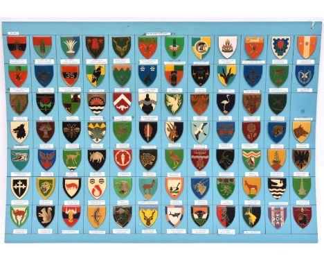 83 different South African army plastic covered shield shoulder flashes, with spike and clasp fittings, identified and mounte