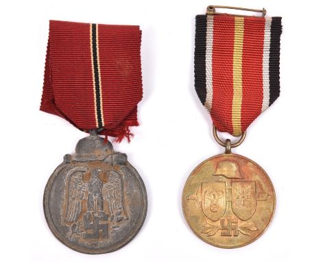 A Third Reich Eastern Front medal, also a Spanish “Blue Division” Russian volunteer medal, both with ribbons as worn. GC (2) 