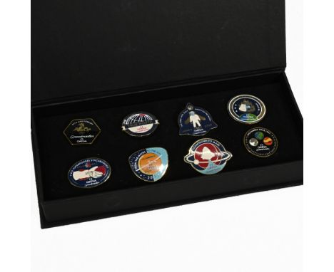 An Omega Speedmaster 50th Anniversary boxed pin badge set, comprising eight different badges to include Apollo 11, first watc