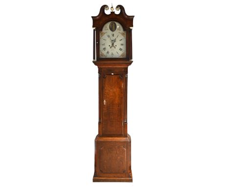 An oak long case clock, circa 1800, with eight day movement, striking the hour to a bell. White dial with Roman numerals, pai