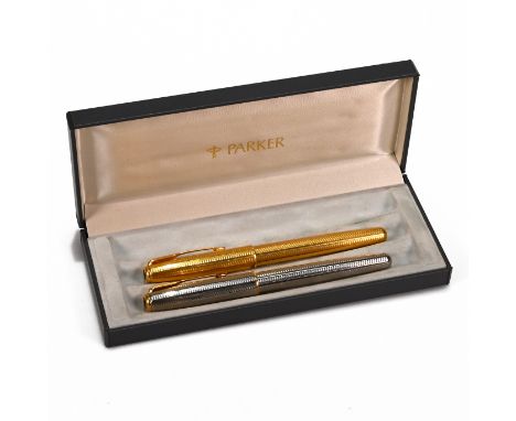 Two Parker Sonnet pens with 18K 750 nibs. The first in "Cascade Gold" pattern, the second of similar white metal with gilt tr