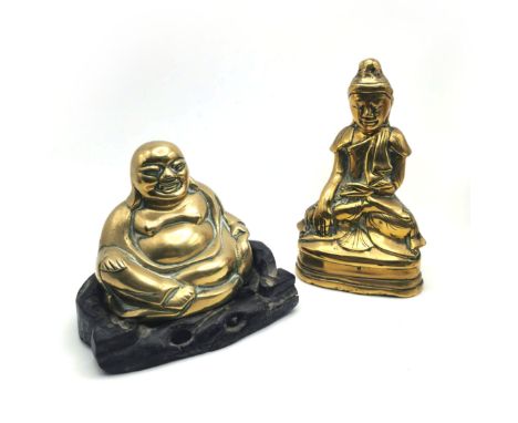 Two brass Buddha's. The first a 19th Century polished brass Buddha seated in the Bhumisparsha mudra (Earth Touching pose). Pr