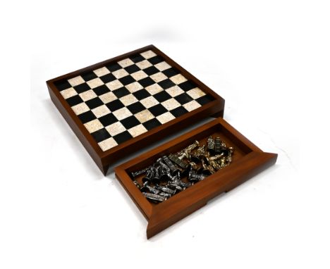 20th Century marble chessboard in a hardwood frame with two drawers under containing a gilt and silvered metal chess set and 