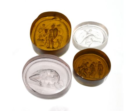 Four Georgian intaglios. The first a pale amethyst colour, squat oval, engraved "MARCHANT" and depicting a semi-naked Greco-R