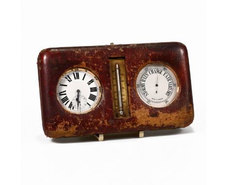 A travelling desk set, comprising a Goliath watch, a similar barometer, in a leather case with a thermometer to the centre, 2