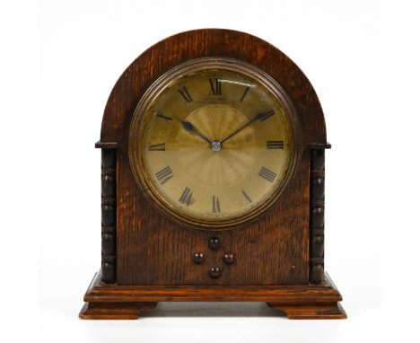 A small circa 1930's French platform escapement mantle clock retailed by Kemp Brothers of Bristol, the dial in engine turned 