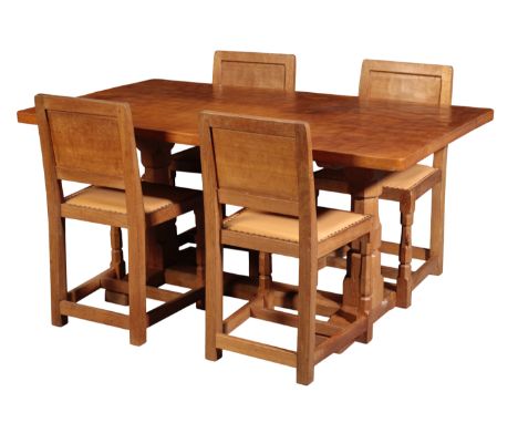 ROBERT 'MOUSEMAN' THOMPSON (1876-1955): AN ENGLISH OAK REFECTORY-TYPE DINING TABLE AND FOUR CHAIRS the rectangular adzed top 