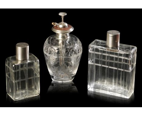 MAPPIN & WEBB: TWO SILVER-GILT TOPPED CRYSTAL SCENT BOTTLES each of rectangular form, engraved in a double line pattern, silv