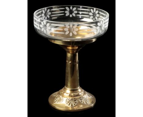 C & K TIEL, HOLLAND: AN ART NOUVEAU STYLE POLISHED BRASS TAZZA the stand relief decorated in the Art Nouveau manner with acan