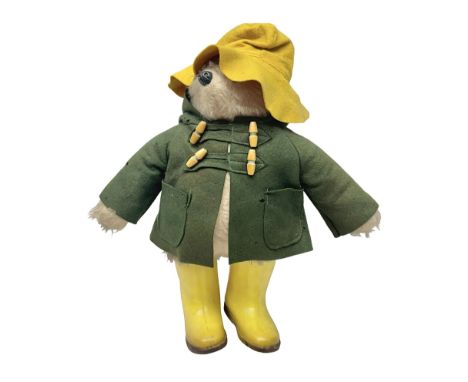 Vintage Paddington Bear teddy with yellow felt hat, green coat and yellow Dunlop boots, H48cm