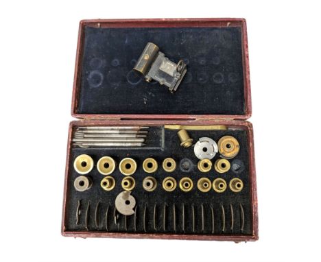 Clock makers lathe accessories, in fitted case, inscribed Accessories Pour Outil A Arrondir, together with a miniature reflec