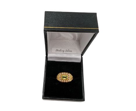 Silver-gilt peridot and pearl ring, stamped Sil, boxed Condition Report:Size O
