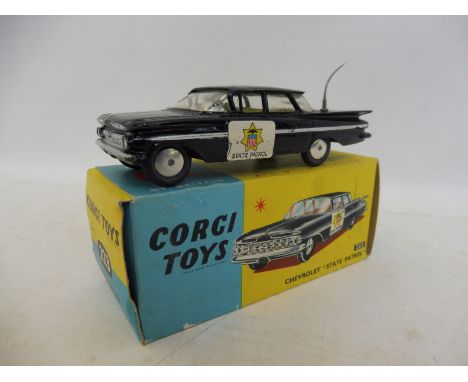 A boxed Corgi Chevrolet State Patrol car, no. 223.