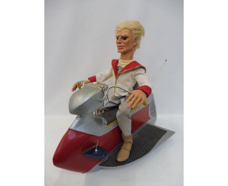 A Gerry Anderson specialist made life-like puppet-type figure on a scooter made by Duncan Willis of 'replica gerry anderson p