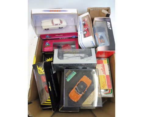 Fourteen boxed model sports cars including an early Solido Porsche Spyder.