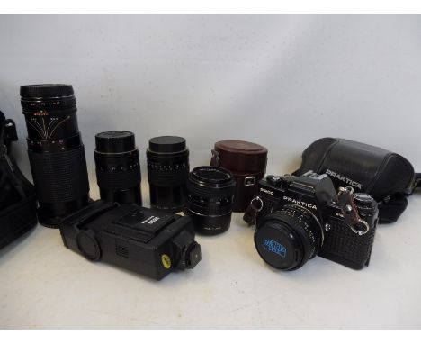 A Praktica B200 camera with five lenses, one being a Carl Zeiss Jena II.