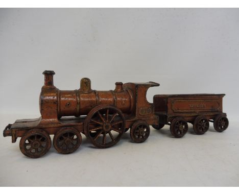 A rare cast iron carpet train by Henry Wallwork of Manchester, original finish, circa 1892.