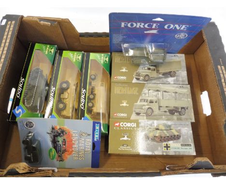 A selection of Solido and Corgi boxed military models.
