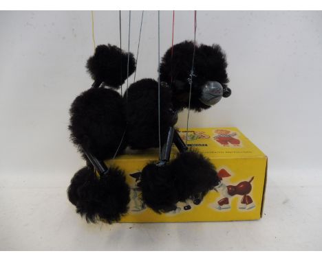 A boxed Pelham Puppet 'Poodle'.