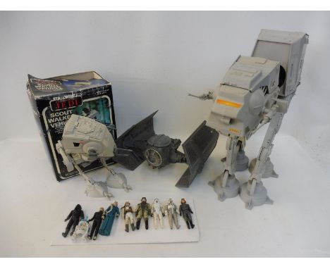 A collection of Star Wars to include a loose AT-AT, a boxed scout walker vehicle and nine loose figures, to include R2D2, lig