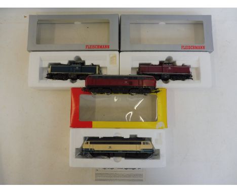 Three boxed Fleishmann Diesel Locomotives and an unboxed Lima Diesel.