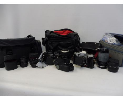 A Practica Super TL3 camera with a 50mm lens, a Practica electronic camera with a 50mm lens and five further lenses etc. 