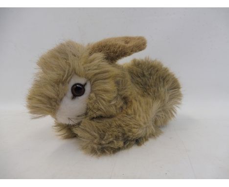 A Steiff rabbit with button and label to the ear. 