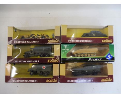 Six boxed Solido military models.