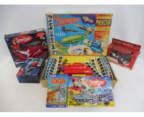 A boxed Chad Valley Thunderbirds 'Give-a-show' battery operated projector, a boxed Dinky Toys Zygon Patroller no. 363 and var