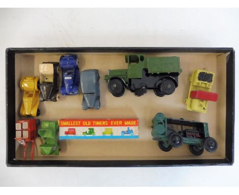 A tray of miniature die-cast cars including Austin 7, a die-cast stationary engine etc.