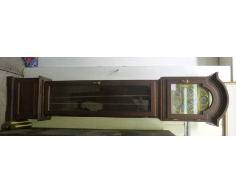 A modern mahogany longcase clock, having an arched hood, over a glazed pendulum door, on a box base and bracket feet; the chi