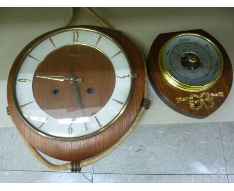 A 1960s Kienzle nautically inspired, teak cased wall timepiece, faced by a baton and Arabic dial  7''dia; and a contemporary 