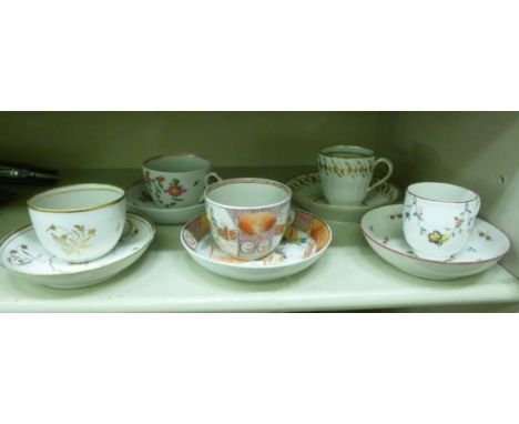 Five late 18thC New Hall porcelain tea cups and saucers, variously decorated with gilded floral and other designs: to include