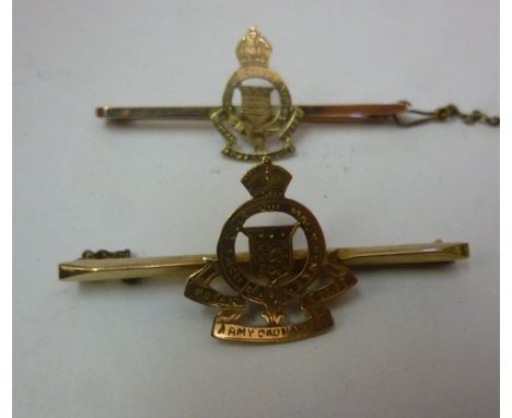 A gold coloured metal box brooch, bearing the engraved and pierced emblem of the Royal Army Ordnance Corp. stamped 9ct; and a