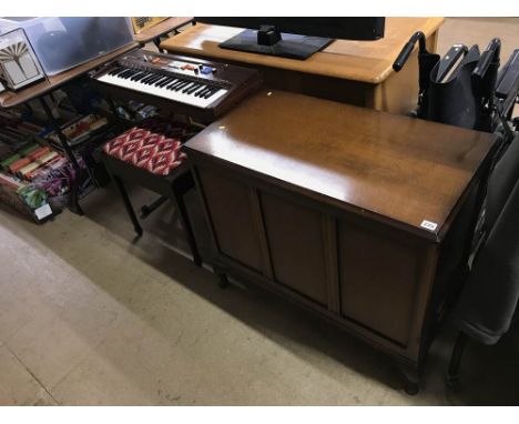A Casio 403 keyboard, a piano stool and blanket box