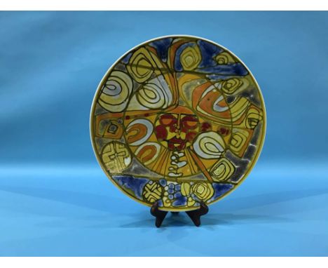 A large Poole pottery Sun Face charger, diameter 36cm