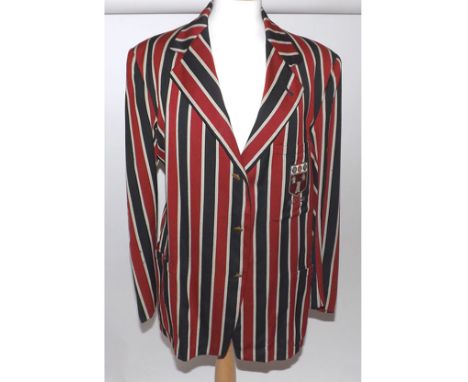 Mid-20th Century school blazer in navy, red and cream stripe with emblem to top pocket dated 1951 to 1952
