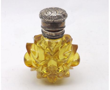 A late Victorian Cut Amber Glass Scent Bottle with hinged and engraved silver lid, apparently unmarked, 3" tall&nbsp;
Conditi