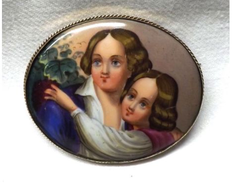 A Victorian Pinchbeck Framed Oval Ceramic Panel Brooch, hand painted with young lovers by a grapevine, 45mm x 60mm  