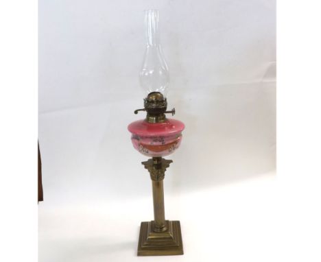 Large Victorian Oil Lamp, clear glass chimney, opaque pink glass floral decorated font, raised on a Brass Corinthian type col