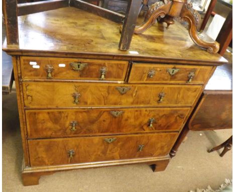 18th Century Walnut veneered chest of two short and three long drawers, Brass handles and escutcheons raised on bracket feet,