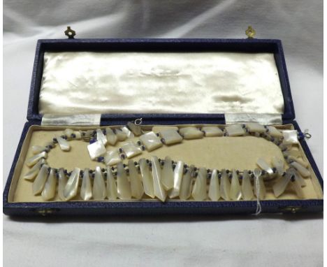 A Vintage Mother-of-Pearl Fringe Necklace with blue and white stone bead dividers, together with a matching Bracelet (2)  