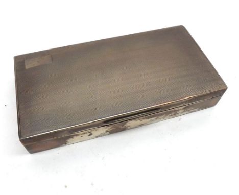 A George V rectangular Silver Mounted Cigarette Box, wavy engine-turned decoration to the lid, cedar-lined interior, the top 