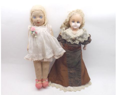 A Chad Valley Felt Face and Cloth Body Doll; together with a Wax Over Composition Doll, with fixed blue glass eyes and blonde