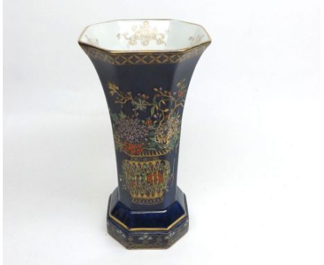 Carlton ware octagonal Vase decorated with Oriental style vases and bouquets on a blue background, with gilt highlights, 9" h